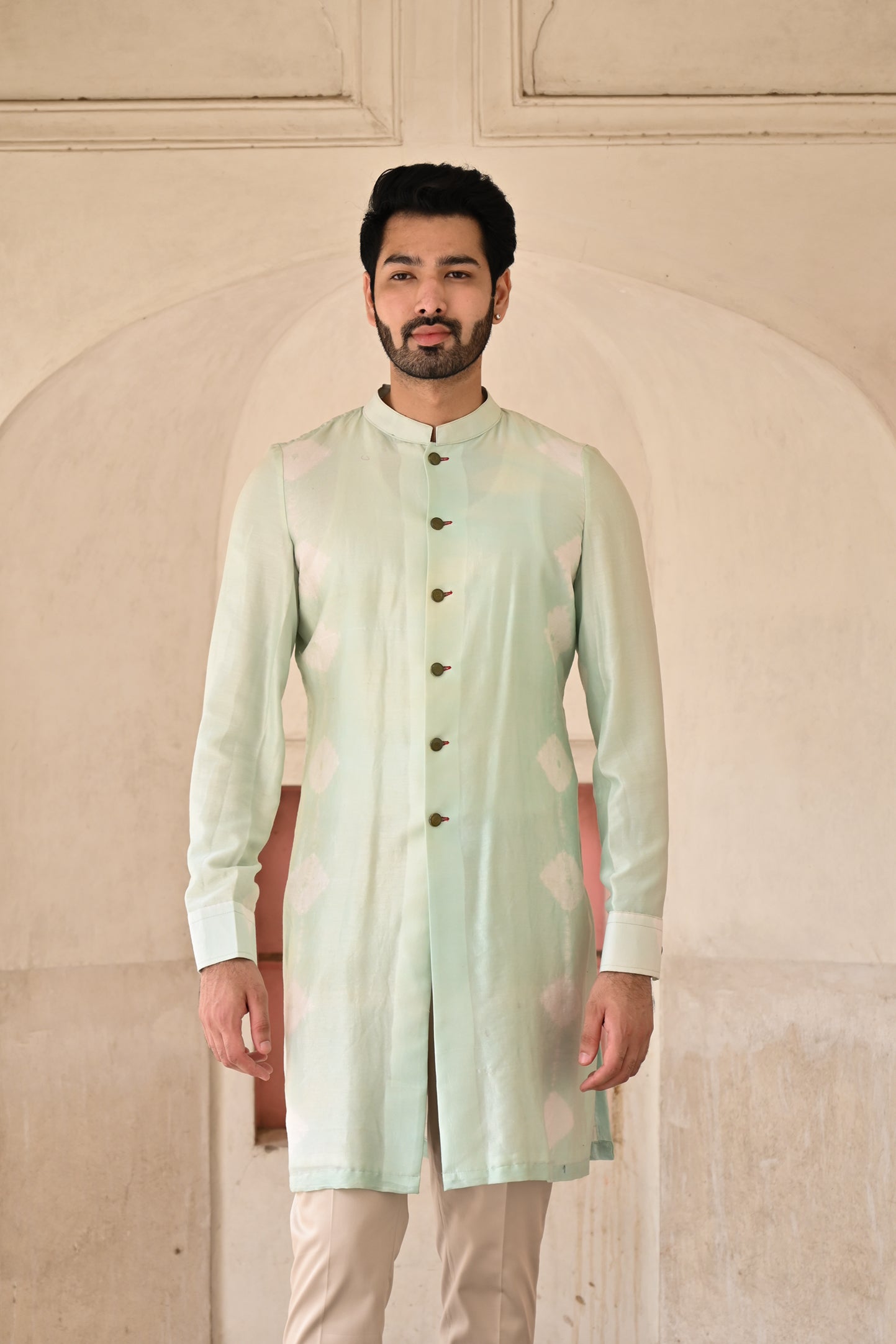 Elegant icy blue kurta set with intricate detailing for groom