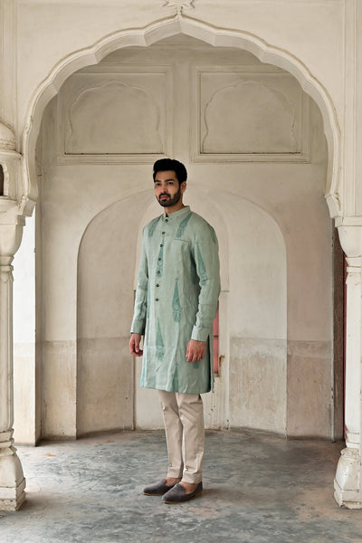 designer kurta set in mint green linen with Meenakari button